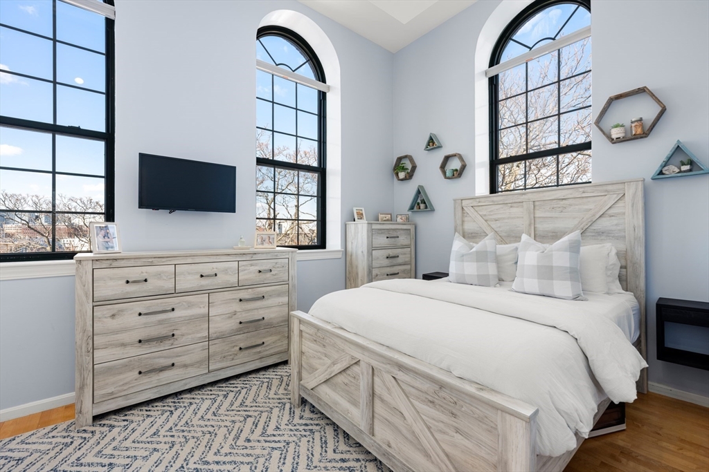 486 East 3rd Street, Unit 6 Boston, MA 02127 - Photo 9 of 20 a bedroom with a bed and a flat screen tv