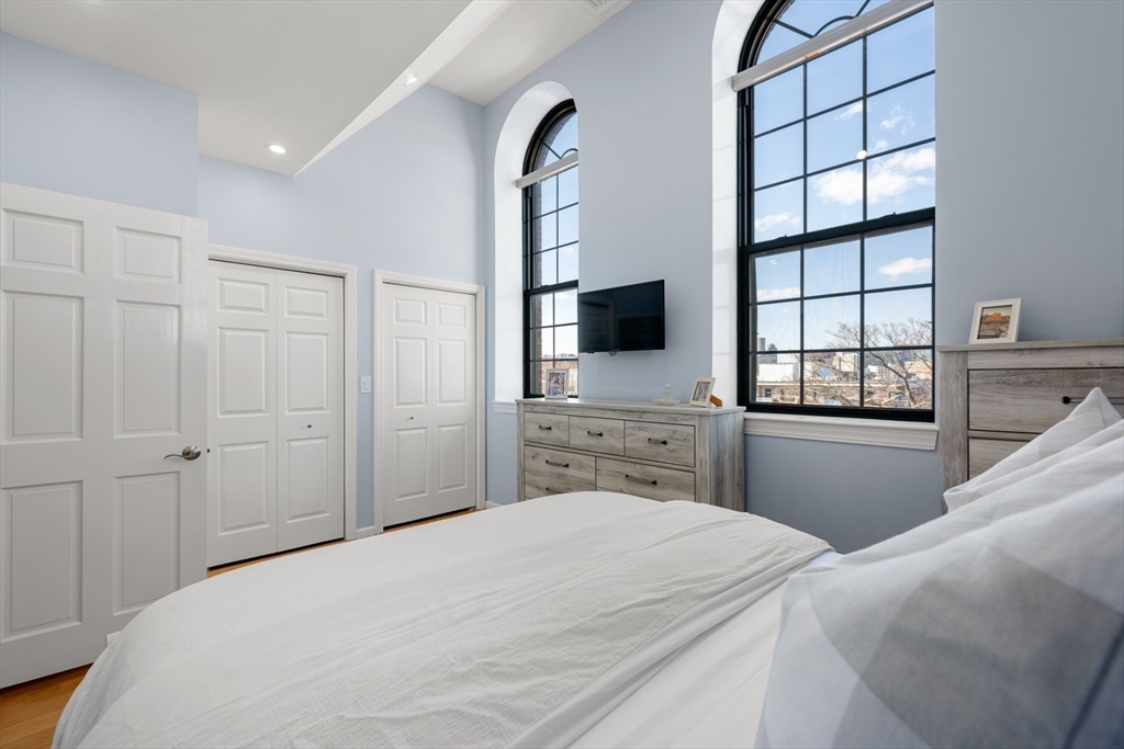 486 East 3rd Street, Unit 6 Boston, MA 02127 - Photo 10 of 20 a bedroom with a bed and a flat tv screen on dresser