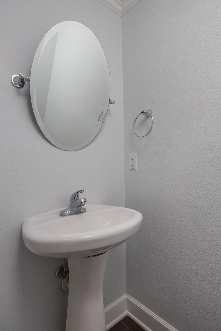 4420 Carter Road, Unit 27 St. Augustine, FL 32086 - Photo 15 of 30 a bathroom with a sink a mirror and shower