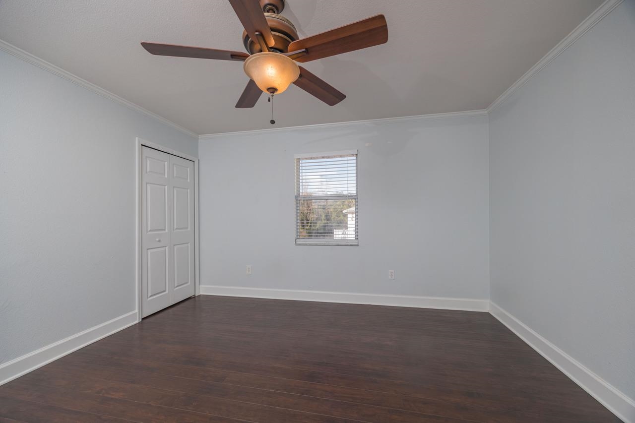 4420 Carter Road, Unit 27 St. Augustine, FL 32086 - Photo 19 of 30 an empty room with a window and a fan