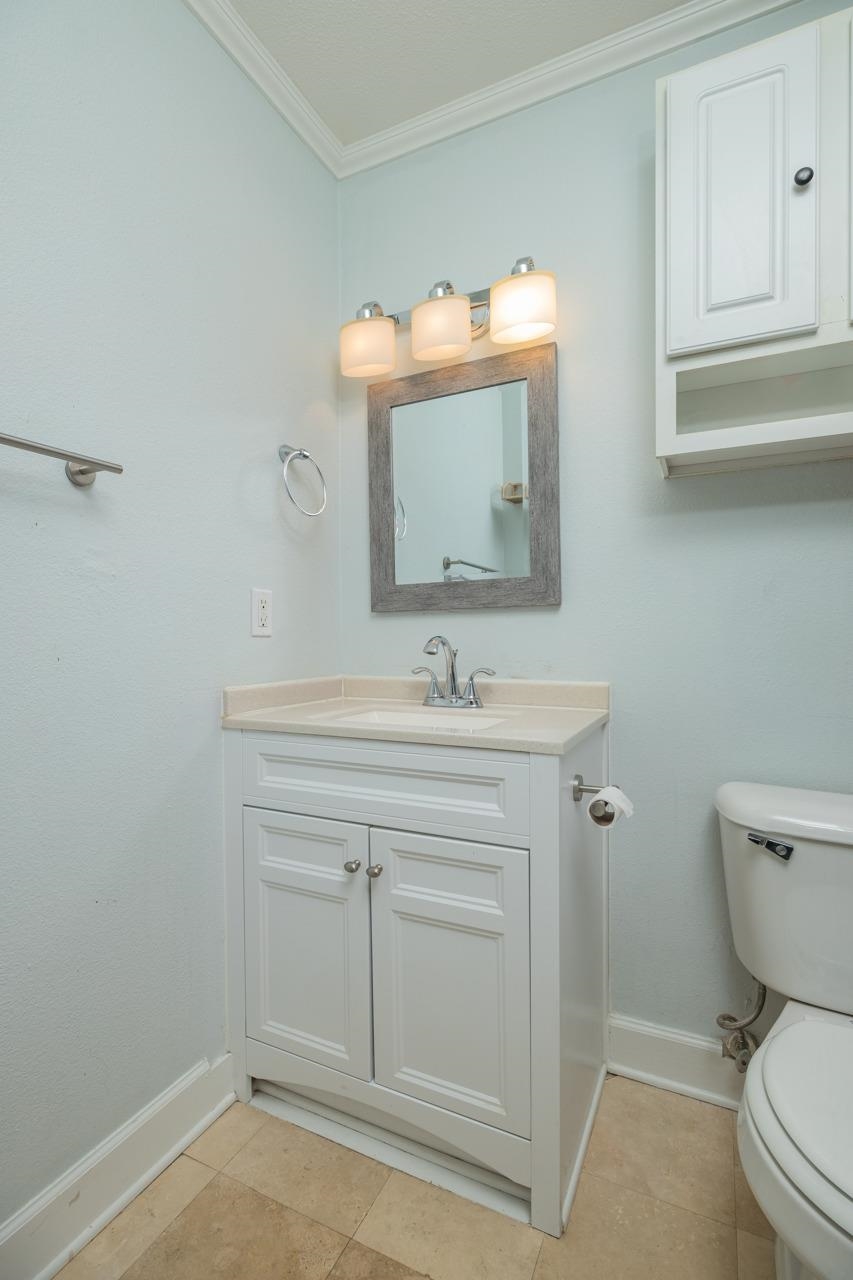 4420 Carter Road, Unit 27 St. Augustine, FL 32086 - Photo 21 of 30 a bathroom with a sink vanity and a toilet