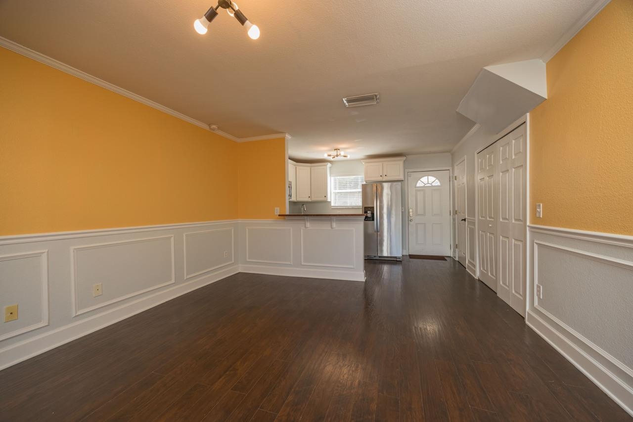 4420 Carter Road, Unit 27 St. Augustine, FL 32086 - Photo 10 of 30 a view of a livingroom with wooden floor