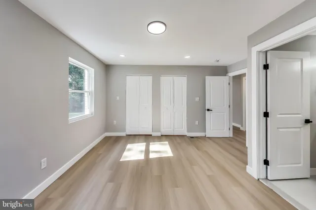 a view of an empty room and window