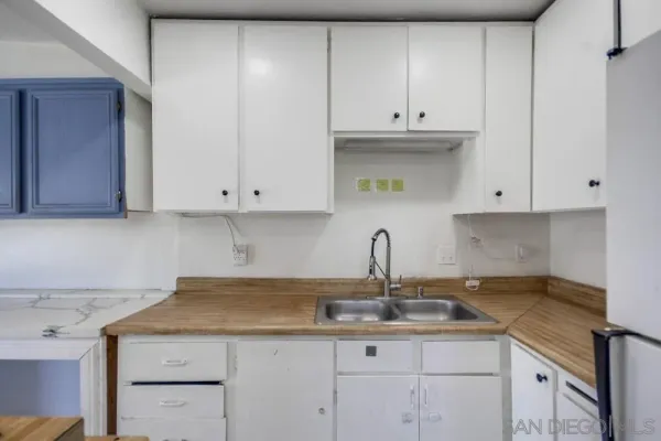 a view of room with window and cabinet
