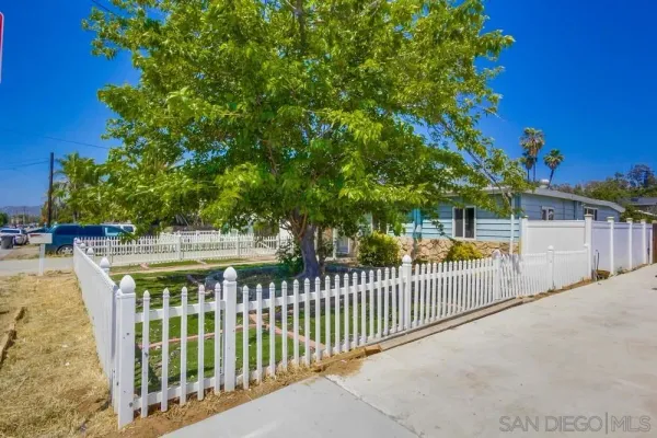 a view of a wrought iron fences in front of house