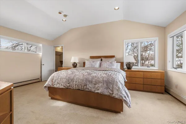 a bed room with a bed and a large window