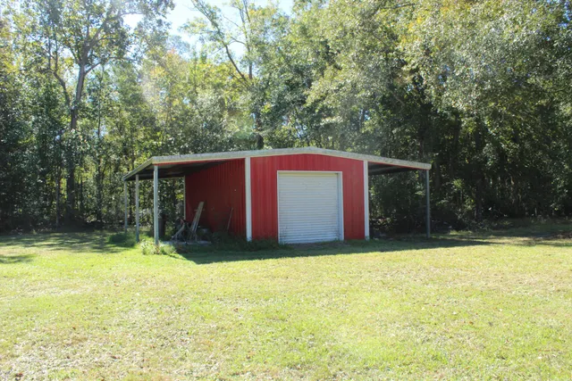 a view of a swimming pool with a yard