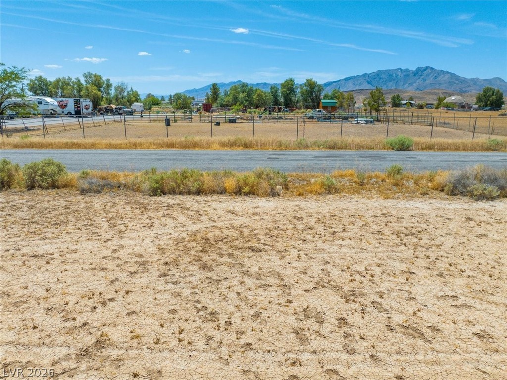 4610 Lawrence Road Pahrump, NV 89048 - Photo 7 of 42 A spacious lot offering mountain views and a paved road for easy access.