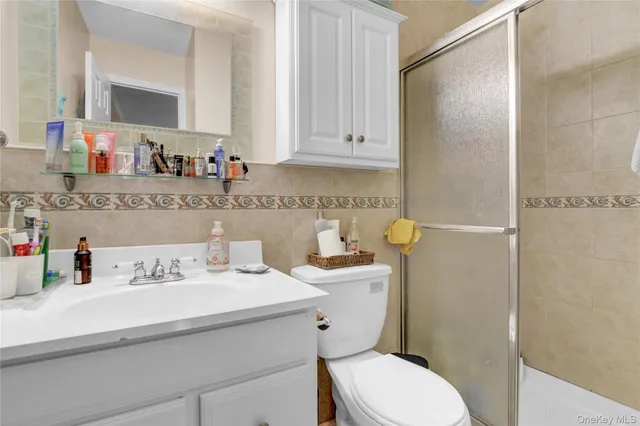 a bathroom with a sink a toilet and vanity