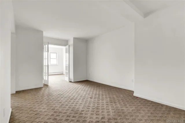 a view of an empty room and window