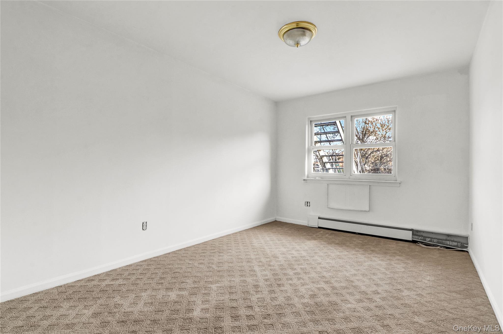 20-39 49th Street Queens, NY 11105 - Photo 18 of 26 an empty room with windows