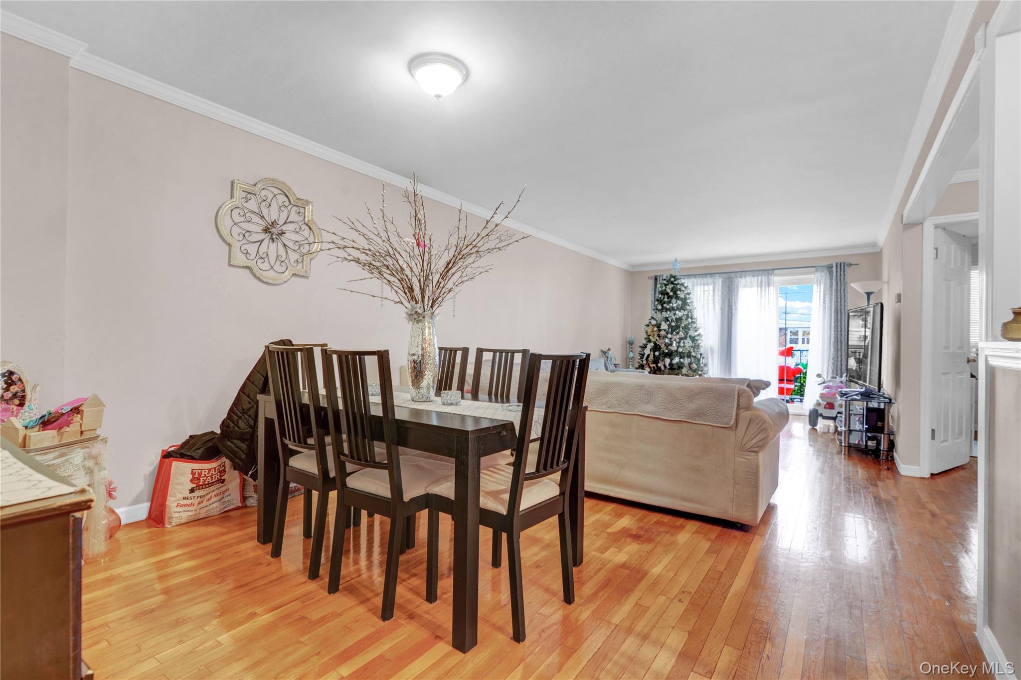 20-39 49th Street Queens, NY 11105 - Photo 6 of 26 a living room with furniture and wooden floor