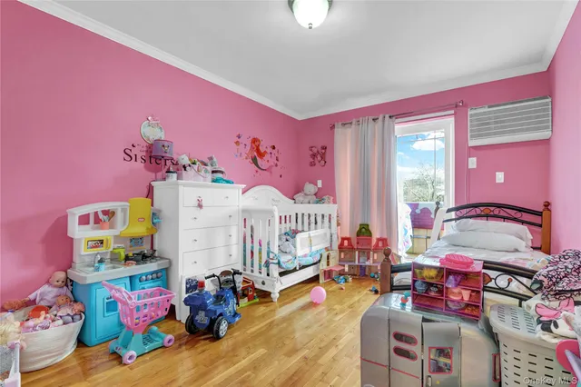 a bedroom with furniture and a baby crib