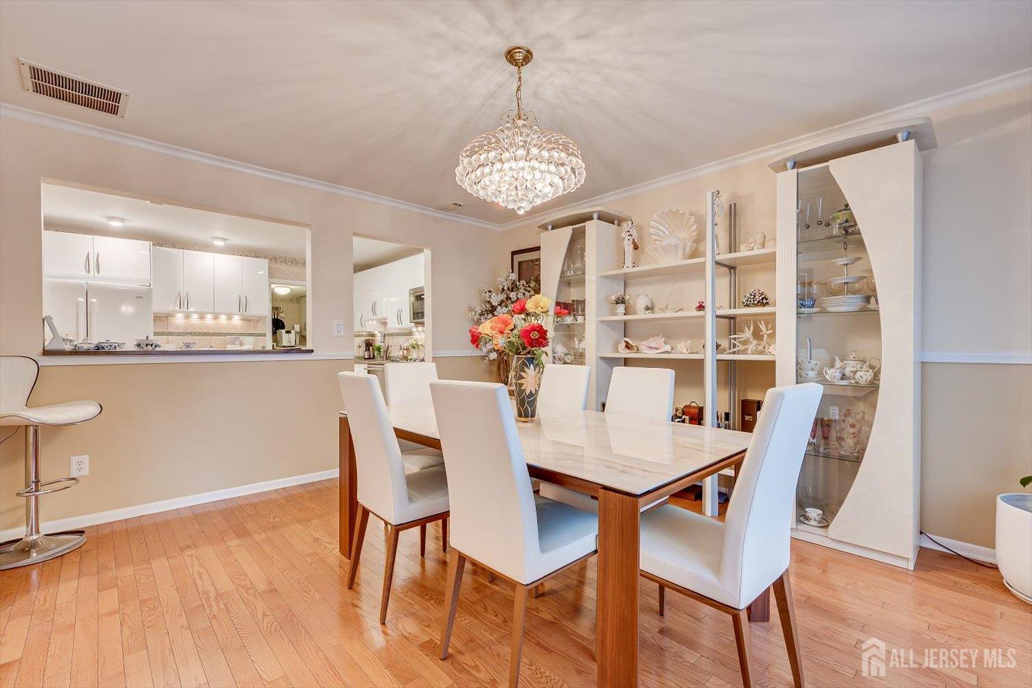 114 Coppertree Court Edison, NJ 08820 - Photo 12 of 47 a view of a dining room with furniture and wooden floor