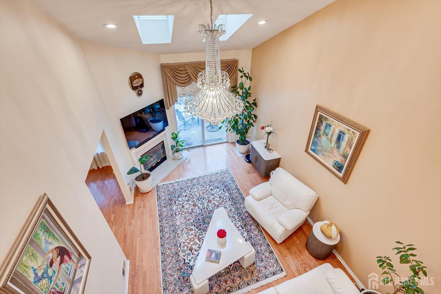 114 Coppertree Court Edison, NJ 08820 - Photo 25 of 47 a living room with furniture and a flat screen tv