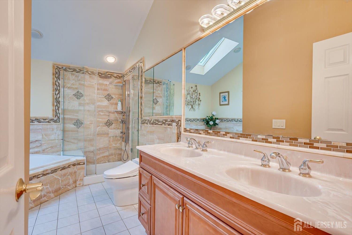 114 Coppertree Court Edison, NJ 08820 - Photo 30 of 47 a bathroom with a granite countertop sink a toilet a mirror and shower