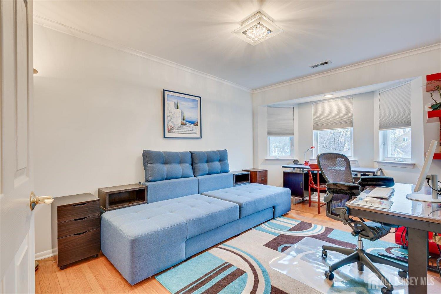 114 Coppertree Court Edison, NJ 08820 - Photo 32 of 47 a living room with furniture and wooden floor