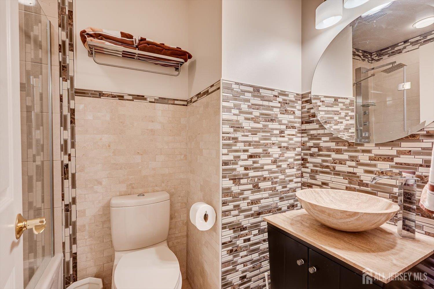 114 Coppertree Court Edison, NJ 08820 - Photo 34 of 47 a bathroom with a granite countertop toilet sink and shower