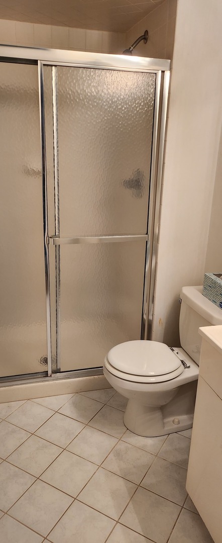 Undisclosed Address Midlothian, IL 60445 - Photo 12 of 23 a white toilet sitting next to a shower