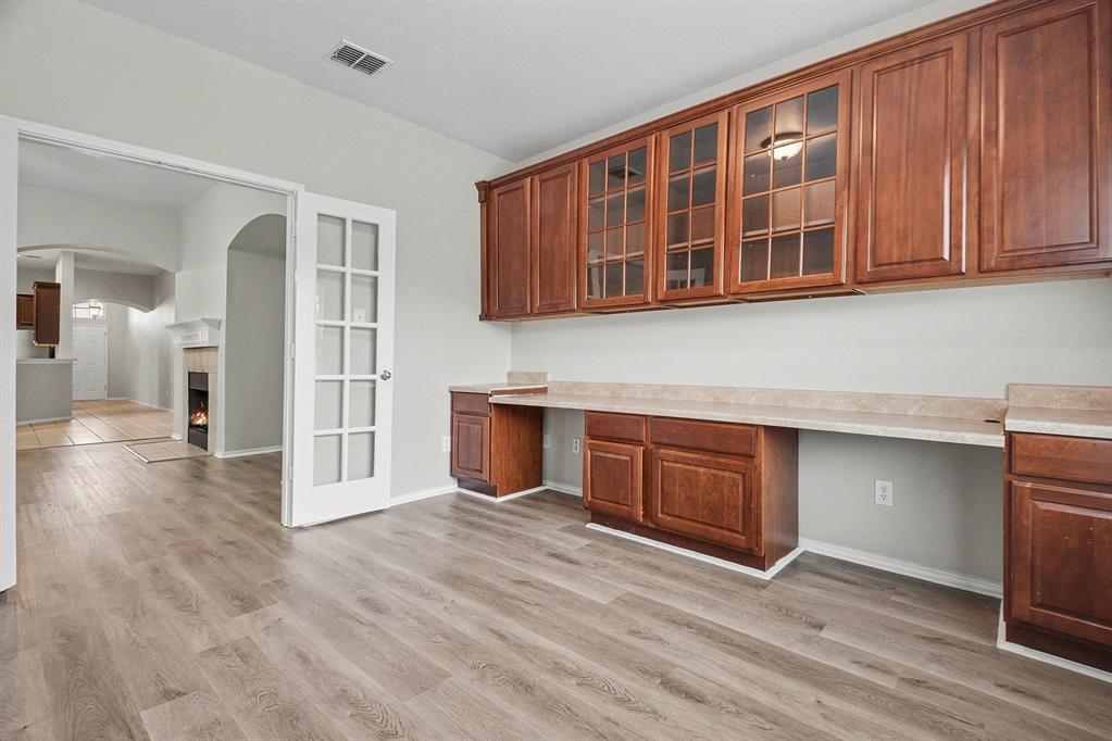 1021 Comfort Drive Forney, TX 75126 - Photo 13 of 37 a kitchen with stainless steel appliances granite countertop a stove and a sink with granite countertops