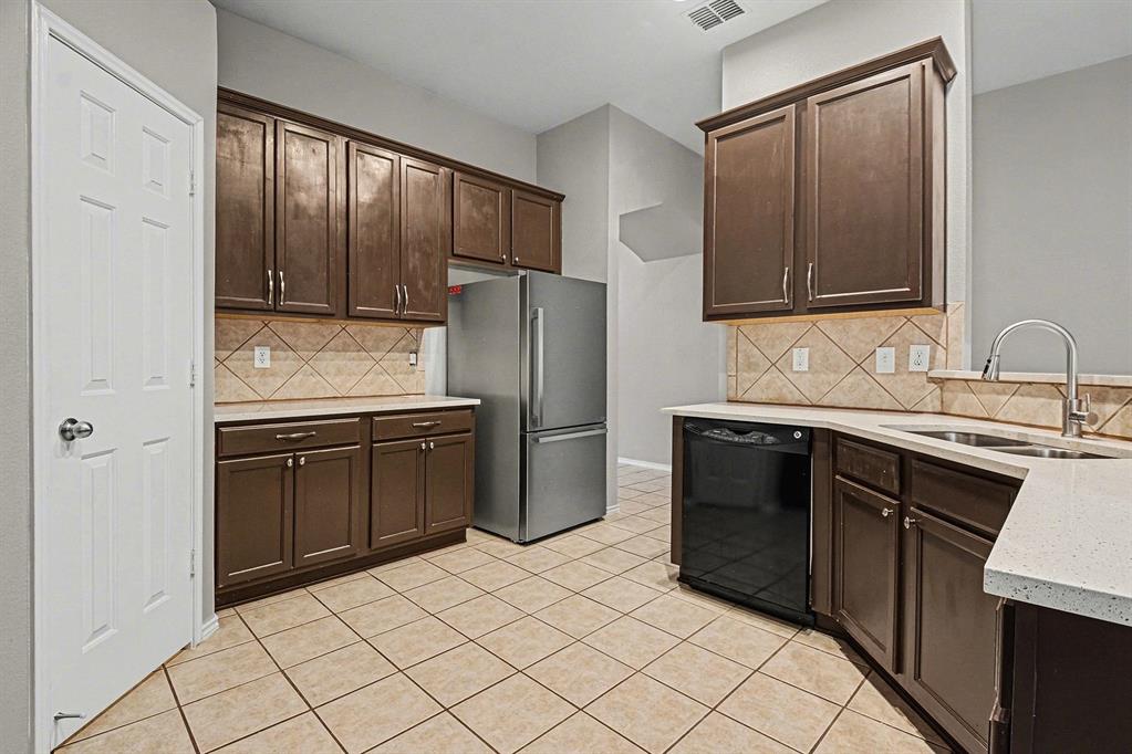 1021 Comfort Drive Forney, TX 75126 - Photo 20 of 37 a kitchen with stainless steel appliances granite countertop a refrigerator and a sink