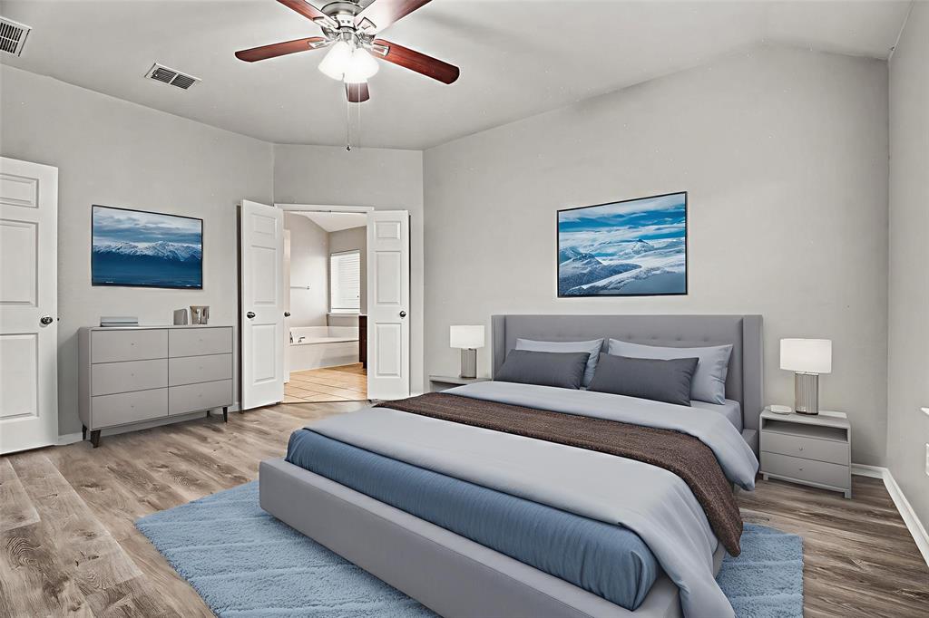 1021 Comfort Drive Forney, TX 75126 - Photo 29 of 37 a spacious bedroom with a bed and ceiling fan