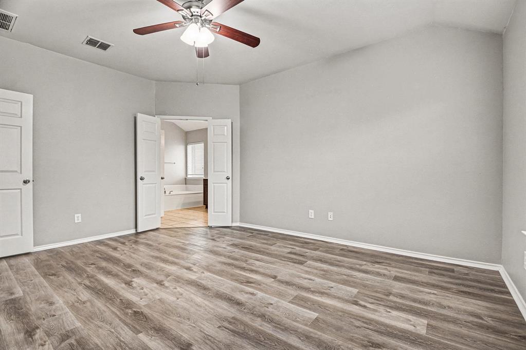 1021 Comfort Drive Forney, TX 75126 - Photo 30 of 37 a view of empty room with wooden floor