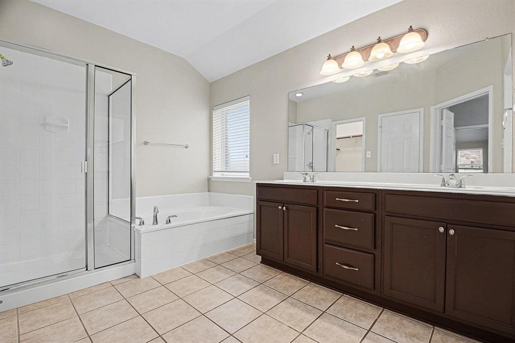 1021 Comfort Drive Forney, TX 75126 - Photo 32 of 37 a spacious bathroom with a tub sink and mirror