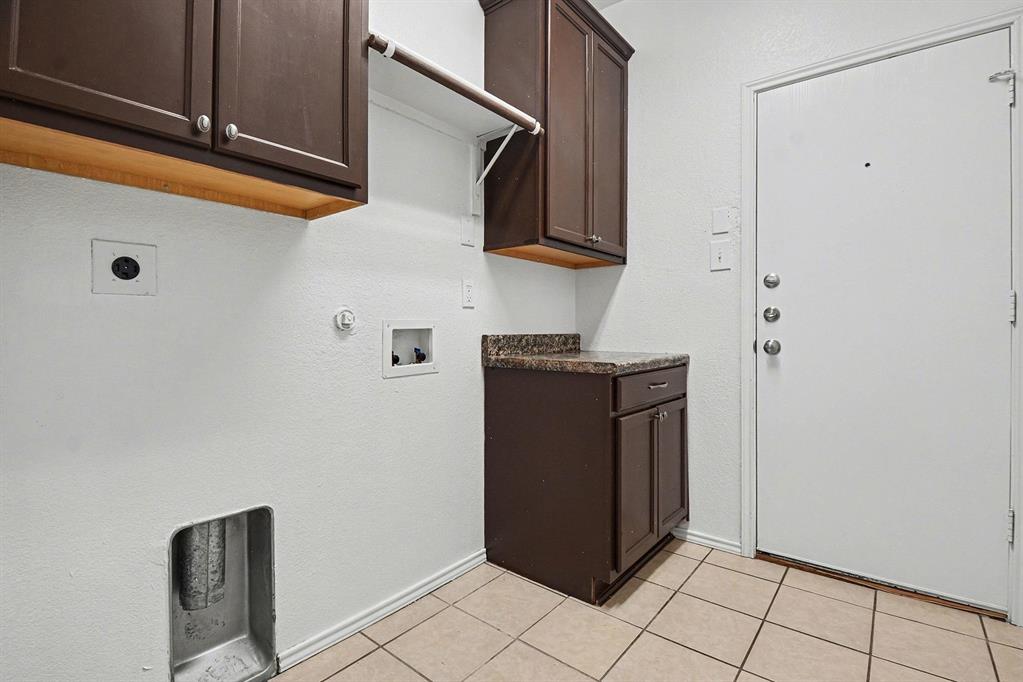 1021 Comfort Drive Forney, TX 75126 - Photo 4 of 37 a view of a storage and utility room with cabinets