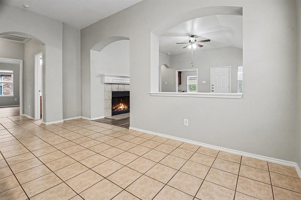 1021 Comfort Drive Forney, TX 75126 - Photo 5 of 37 a view of an empty room with wooden floor and a chandelier