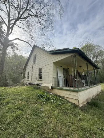 a house with trees in the background