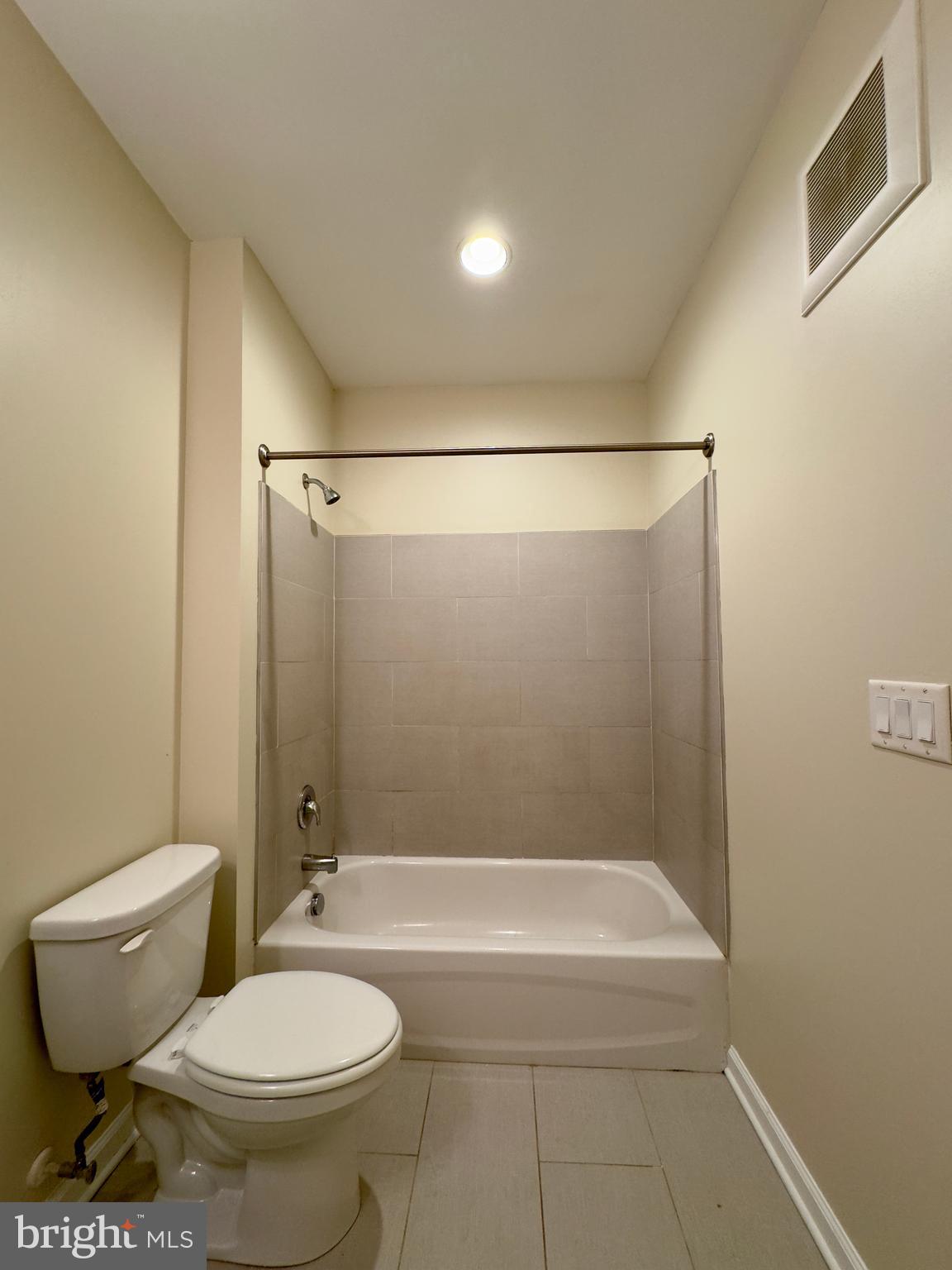 413 North Howard Street, Unit 204 Baltimore, MD 21201 - Photo 11 of 13 a bathroom with a toilet and a shower