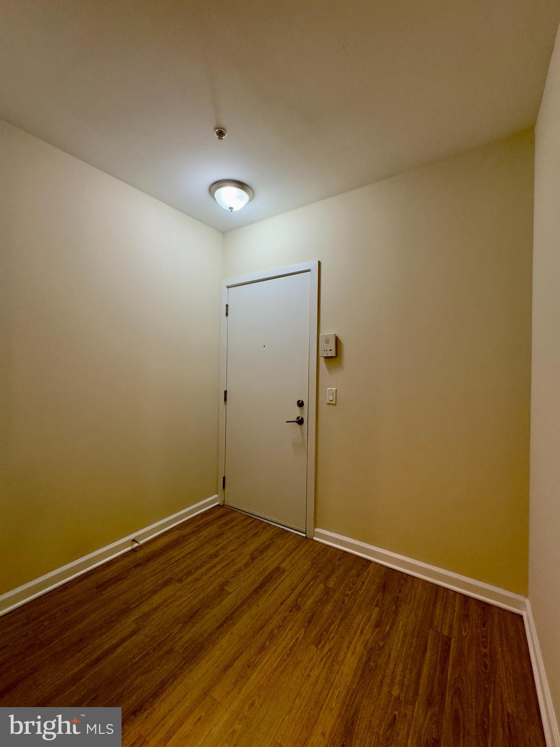 413 North Howard Street, Unit 204 Baltimore, MD 21201 - Photo 2 of 13 a view of room with wooden floor