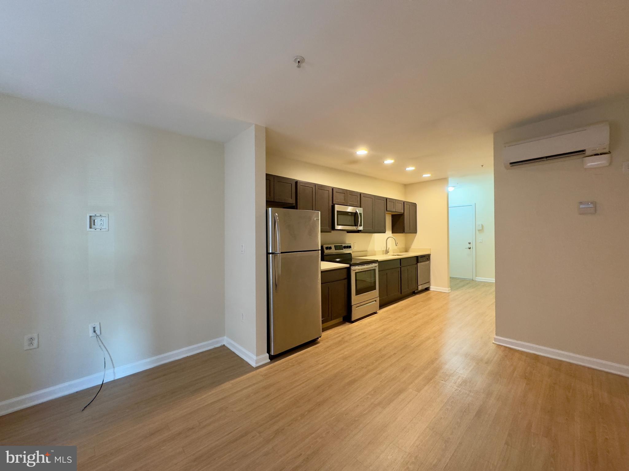413 North Howard Street, Unit 204 Baltimore, MD 21201 - Photo 5 of 13 a view of kitchen with wooden floor