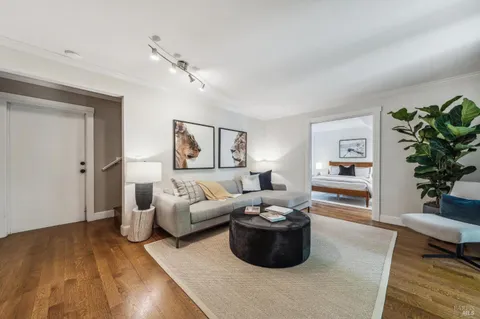 a bedroom with a bed and chair