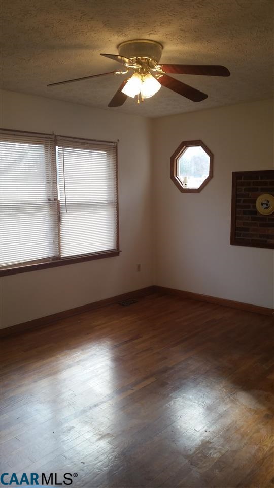 6601 Courthouse Road Louisa, VA 23093 - Photo 15 of 36 an empty room with wooden floor and windows