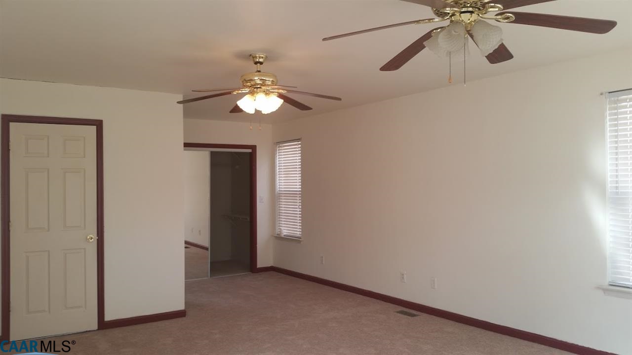 6601 Courthouse Road Louisa, VA 23093 - Photo 25 of 36 an empty room with windows and fan
