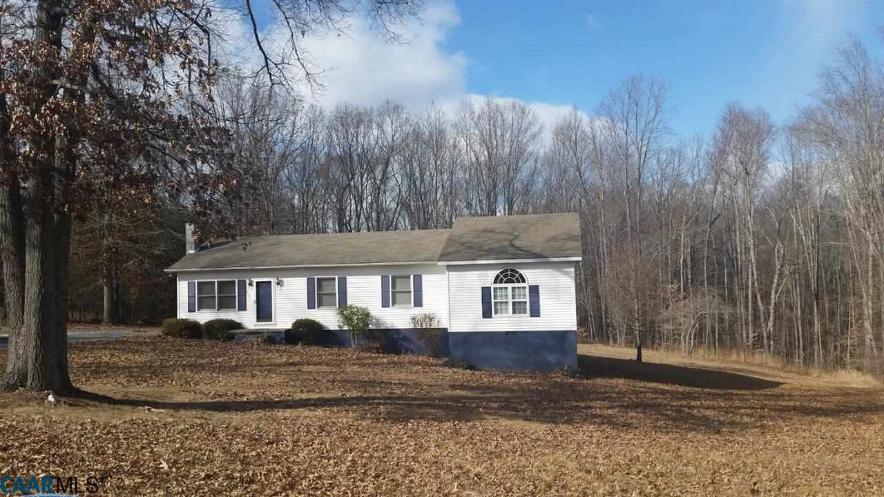 6601 Courthouse Road Louisa, VA 23093 - Photo 7 of 36 a view of a white house next to a yard with large trees
