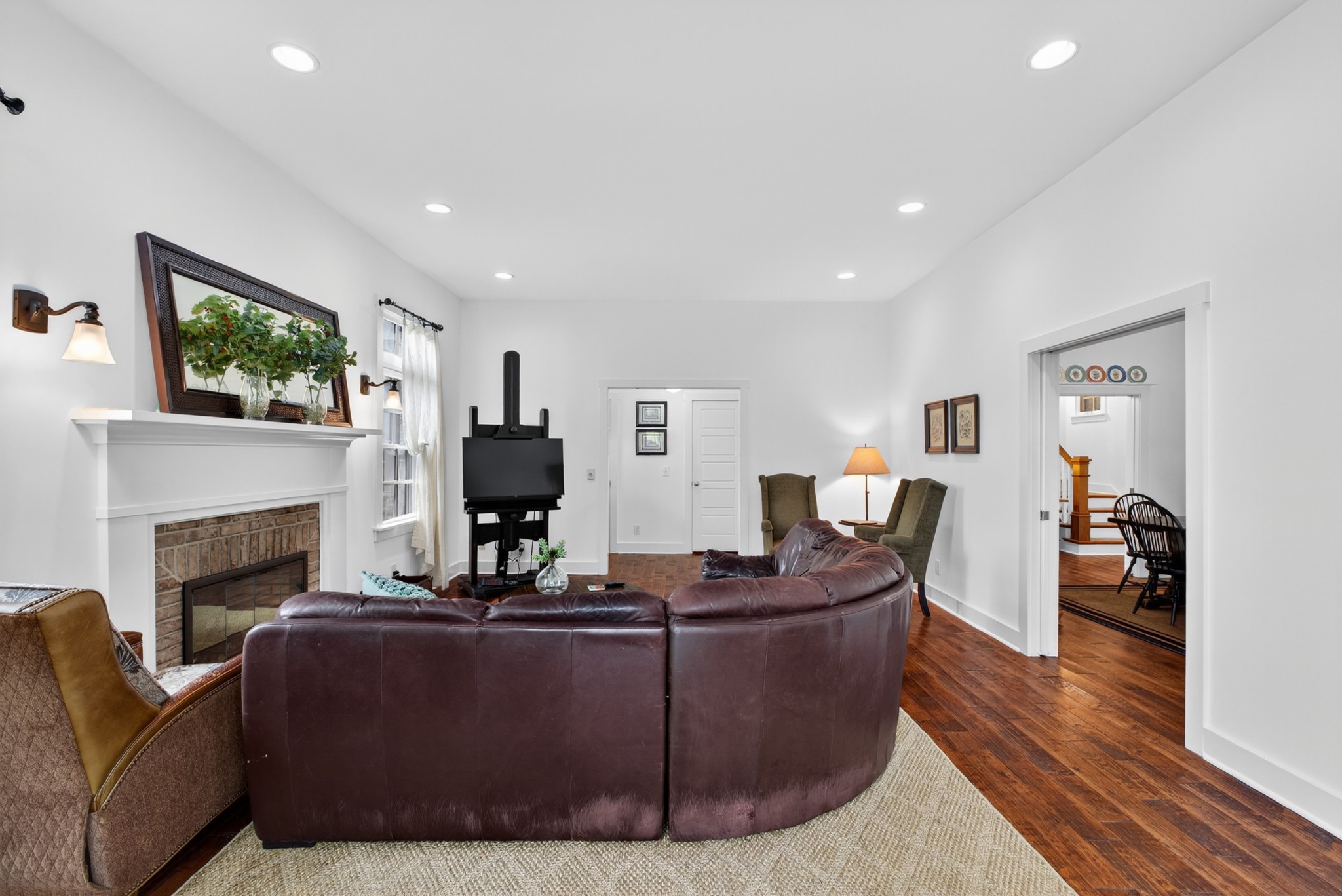123 Jones Road Taft, TN 38488 - Photo 11 of 87 a living room with furniture a fireplace and a flat screen tv