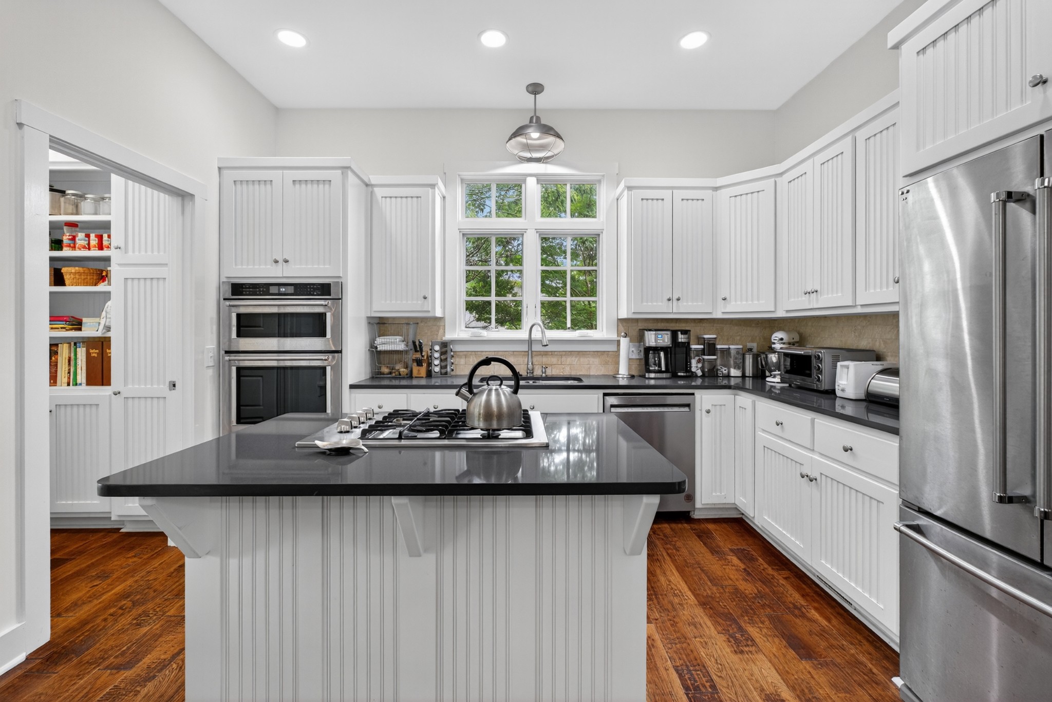 123 Jones Road Taft, TN 38488 - Photo 19 of 87 a kitchen with refrigerator a stove a sink and a window