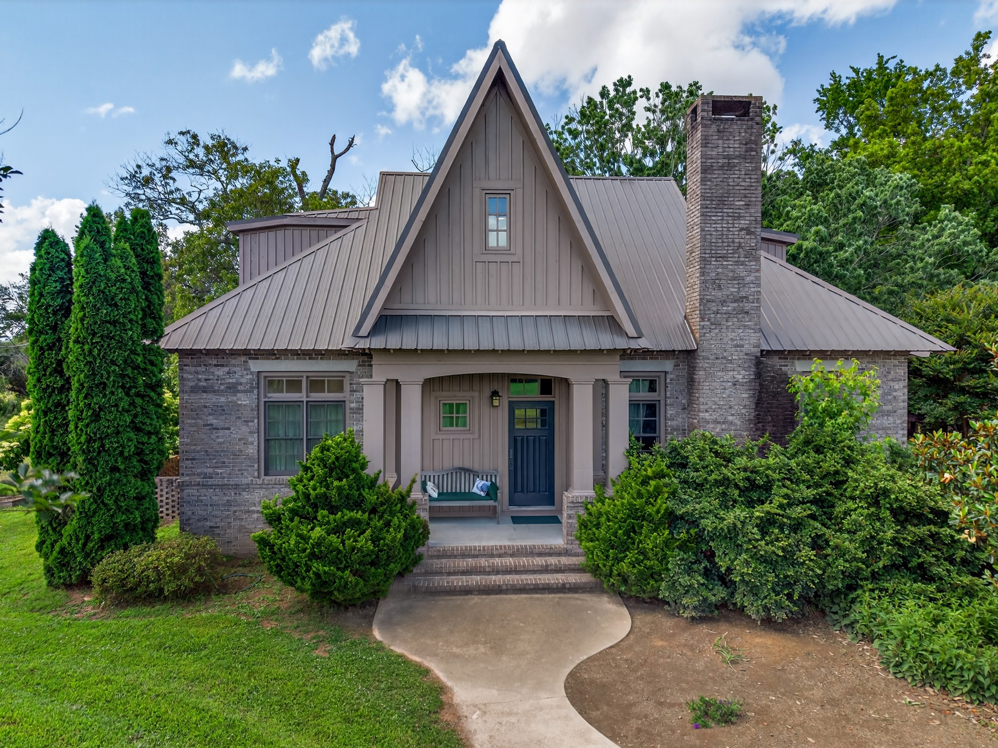 123 Jones Road Taft, TN 38488 - Photo 3 of 87 a front view of a house with a yard and potted plants