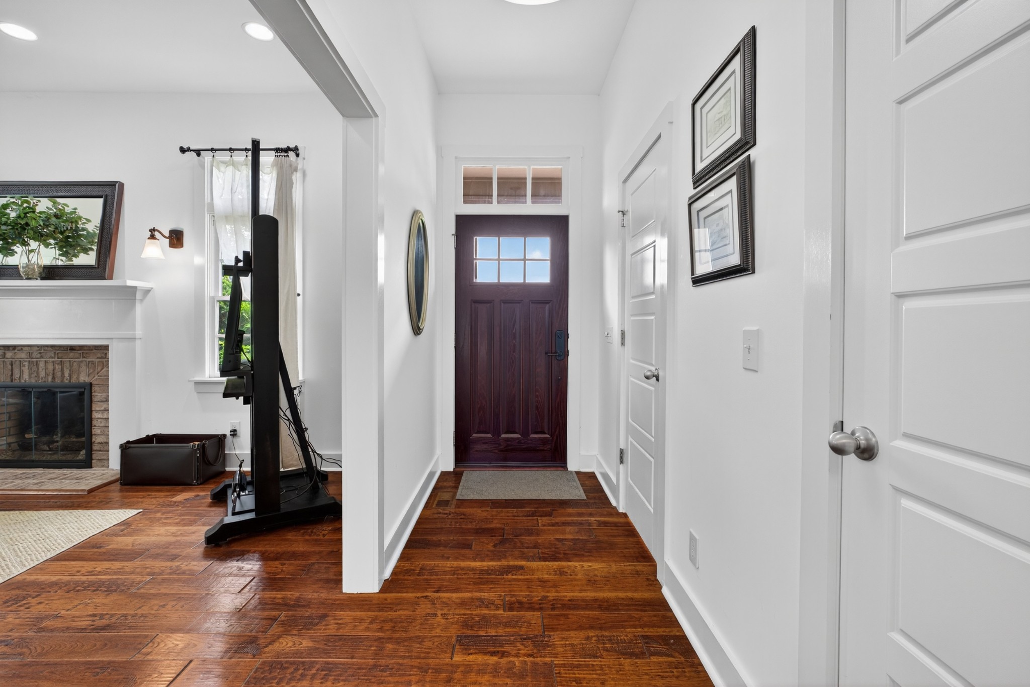 123 Jones Road Taft, TN 38488 - Photo 41 of 87 a view of a hallway with wooden floor and a fireplace