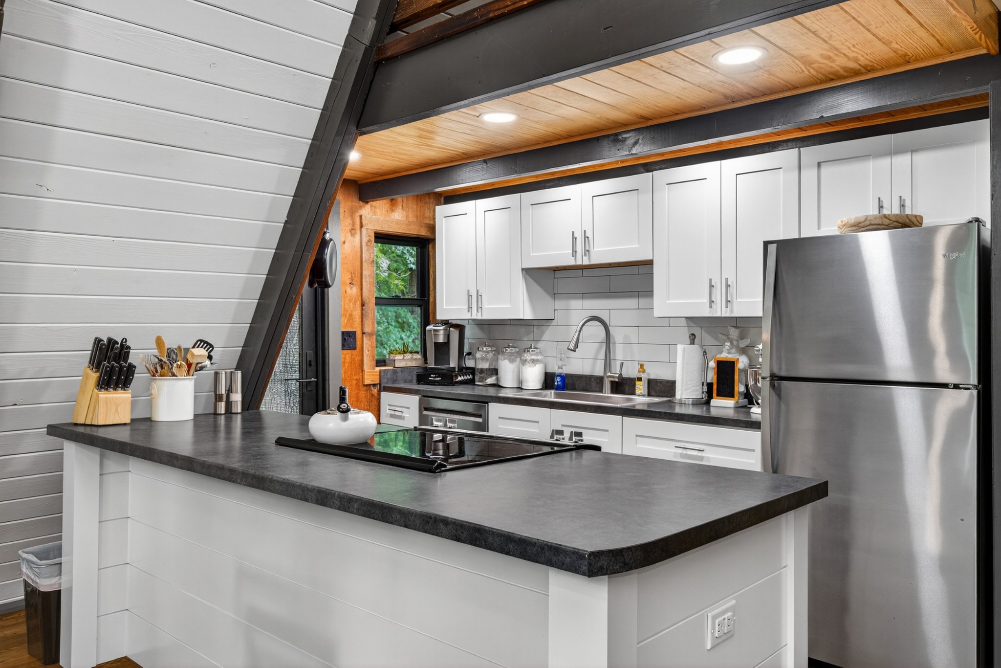 123 Jones Road Taft, TN 38488 - Photo 51 of 87 a kitchen with stainless steel appliances granite countertop a sink a refrigerator and a stove