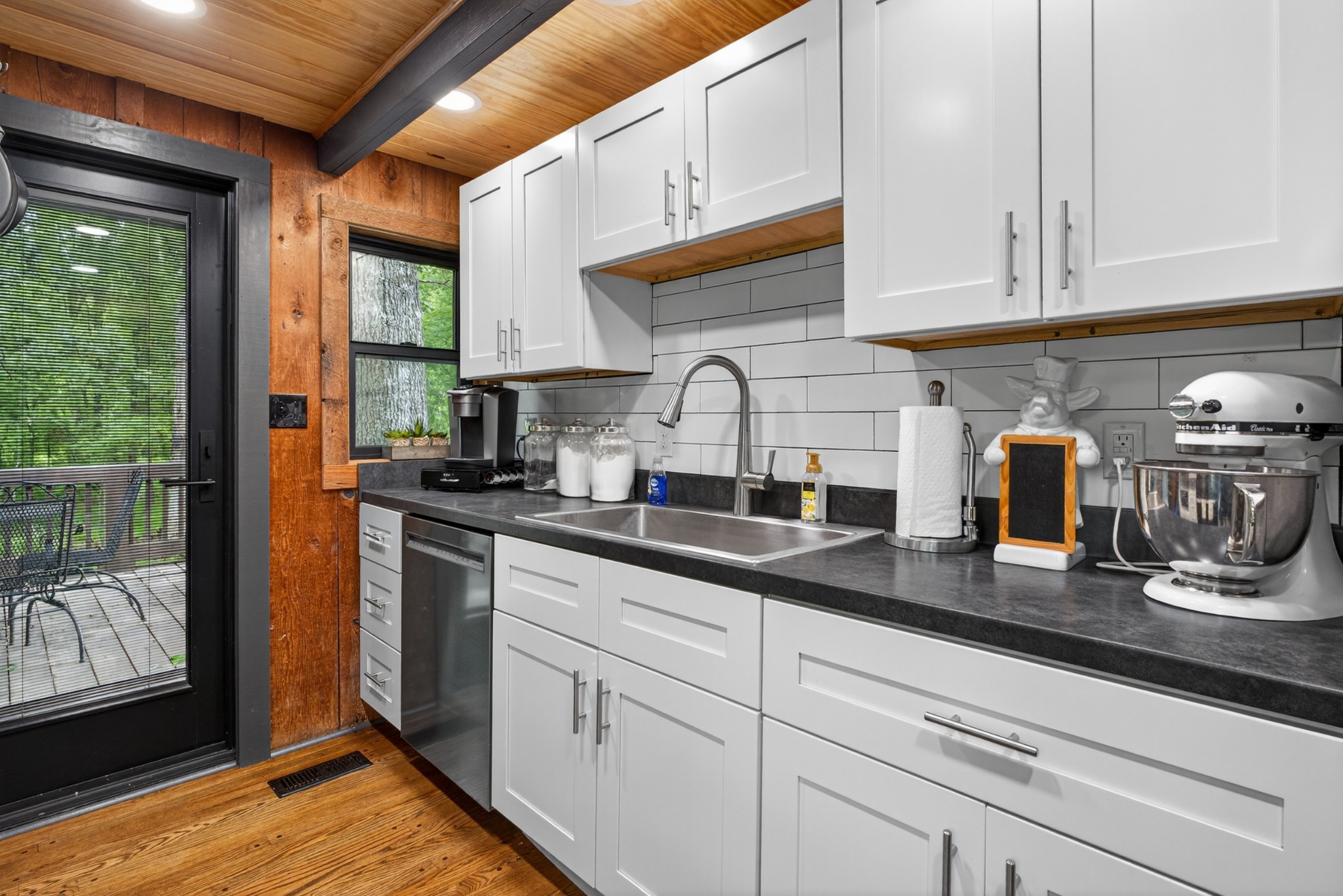 123 Jones Road Taft, TN 38488 - Photo 52 of 87 a kitchen with stainless steel appliances granite countertop a sink a stove and cabinets