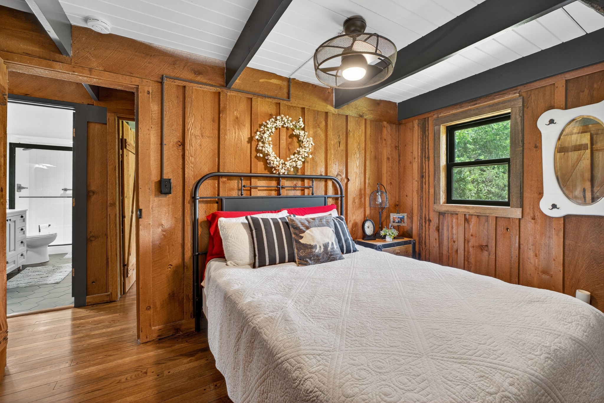 123 Jones Road Taft, TN 38488 - Photo 56 of 87 a bedroom with a large bed and a chandelier