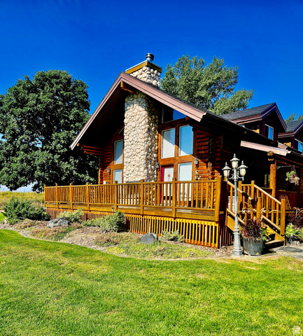 76 Highway 118 Monroe, UT 84754 - Photo 4 of 76 Back of house with log siding, a yard, and a chimney