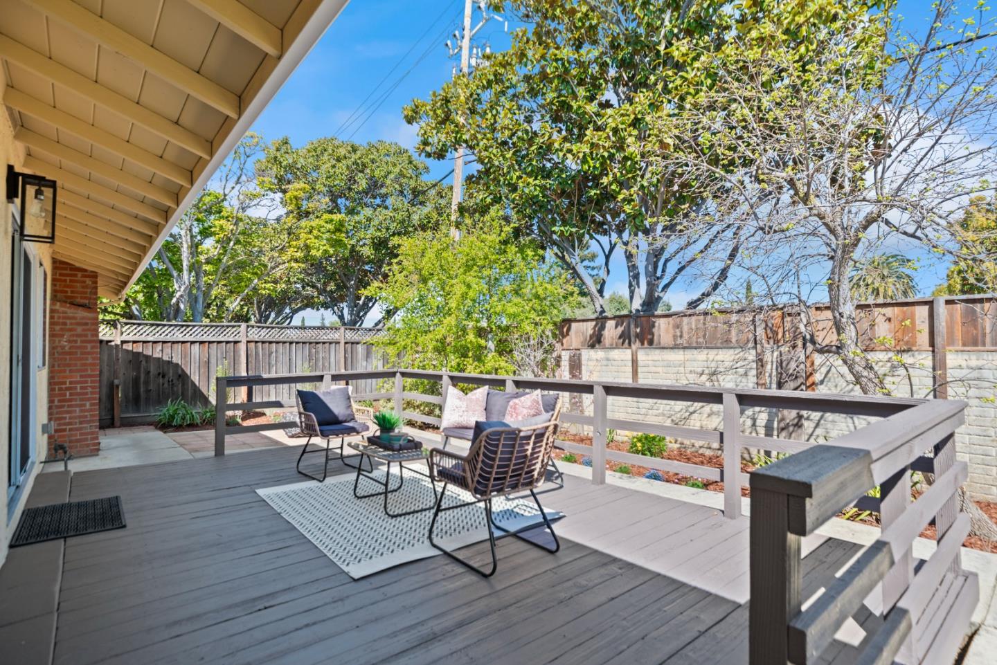 965 Buckeye Drive Sunnyvale, CA 94086 - Photo 25 of 27 a view of deck with table and chairs and wooden floor