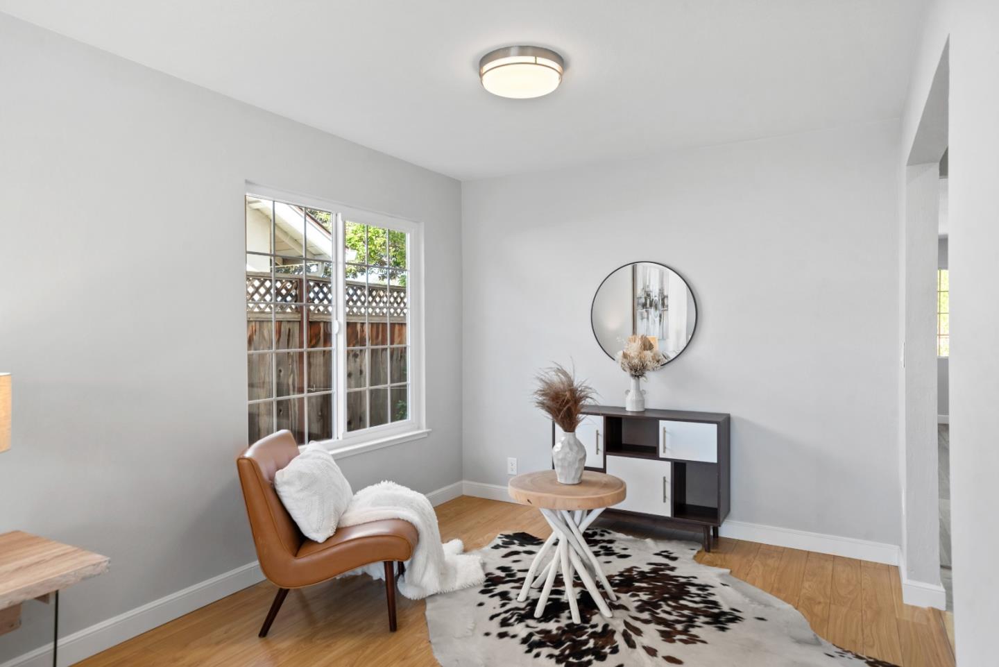 965 Buckeye Drive Sunnyvale, CA 94086 - Photo 6 of 27 a living room with furniture a window and a rug