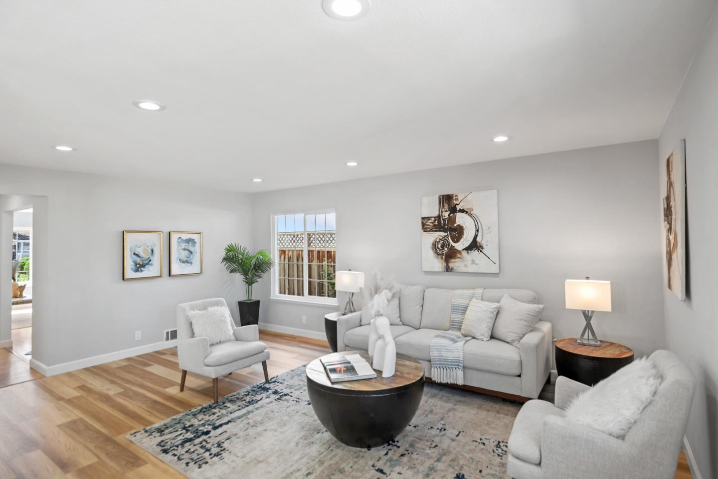 965 Buckeye Drive Sunnyvale, CA 94086 - Photo 9 of 27 a living room with furniture a lamp and a potted plant
