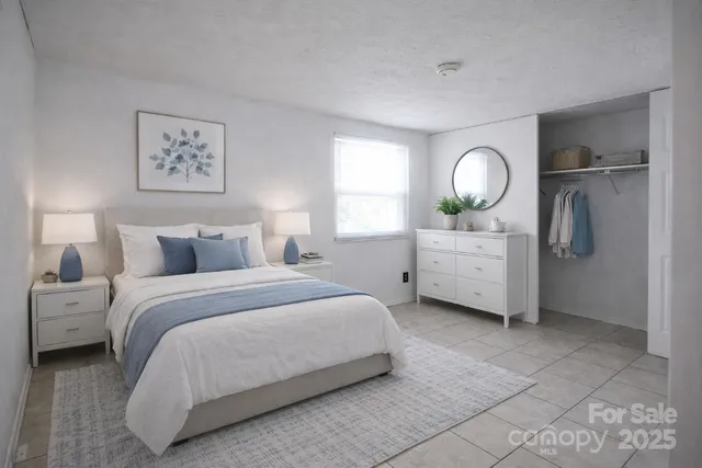 a bedroom with bed and a window